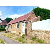 Converted outbuilding with river views Cambs