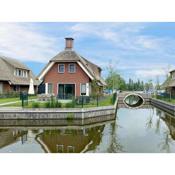 Villa with enclosed garden, in a holiday park on the water in Friesland