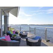Waterfront penthouse with roof terrace and private jetty