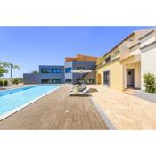 4 bedrooms house with sea view shared pool and enclosed garden at Quelfes
