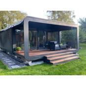 A tiny house with a private garden and a hot tube