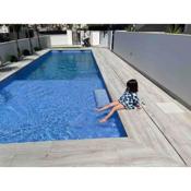 Beach bungalow with swiming pool and long terrace