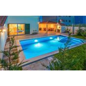 Beautiful home in Mravince with Outdoor swimming pool, WiFi and 3 Bedrooms