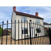 Delightful 2 bed detached home with secure parking