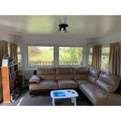 Delightful 3 bedroom holiday home with balcony overlooking fields and a stream