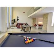 Design Apartment with pool table, gallery and kitchen island