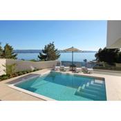 Luxury, seafront Villa Petra with heated pool only 50m from beach