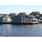 Modern houseboat with air conditioning located in marina
