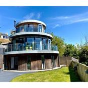 One of the best properties in Lyme! Breathtaking views across the whole bay. 3 stories with 2 tier veranda around the property. Sleeps 6
