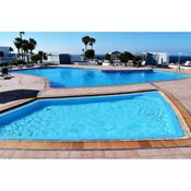 Puerto del Carmen center - New Apartment by the pool and private parking