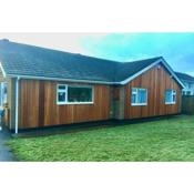 Shore Lodge. 4 bed bungalow only mtrs from the beach. Sleeps 8