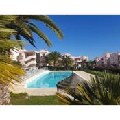 Top-floor 2 BR holiday home with sea view and pool