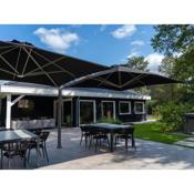 Wellness group accommodation with outdoor spa, on a holiday park near Eindhoven